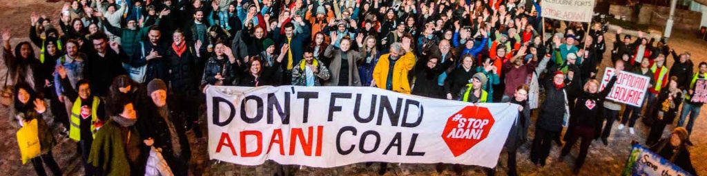 Adani protest don't fund coal banner