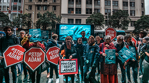 AIG ensure our future not Adani 16x9 AIG insurance protest Stop Adani