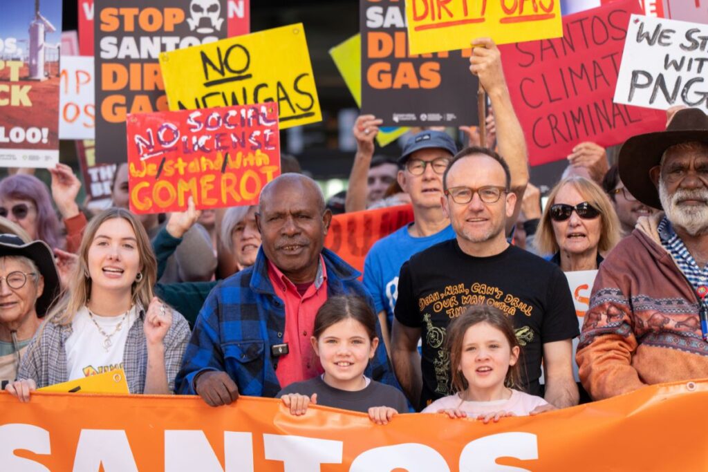 Chief Joseph Ka'au, ACF CEO Adam Bandt, and Garrawa Senior Elder Uncle Jack Green at the 2026 Santos AGM rally